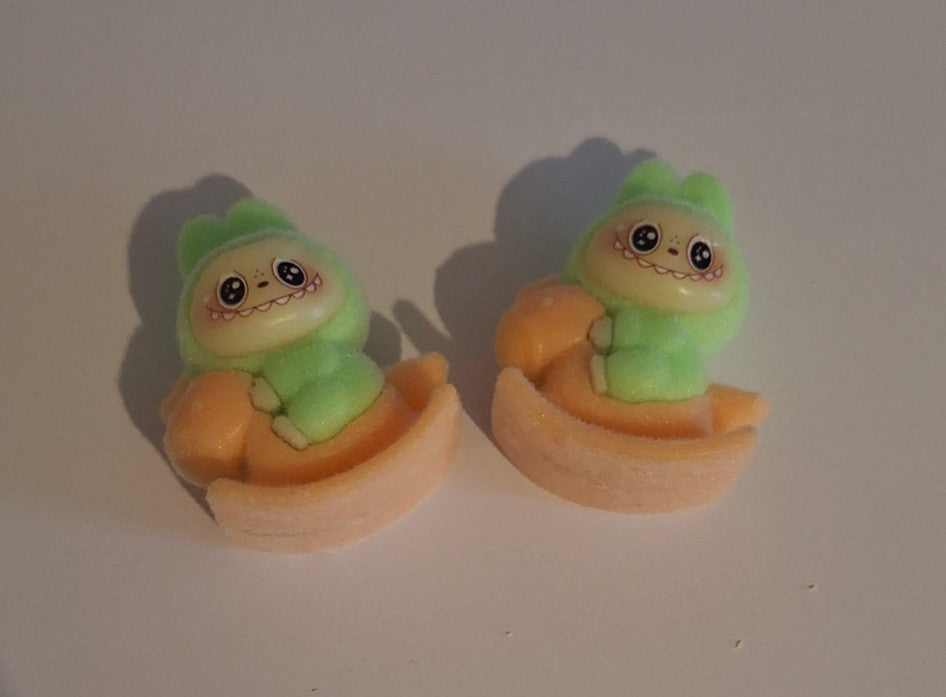Bright green labubu on orange rocking horse felt feel beads