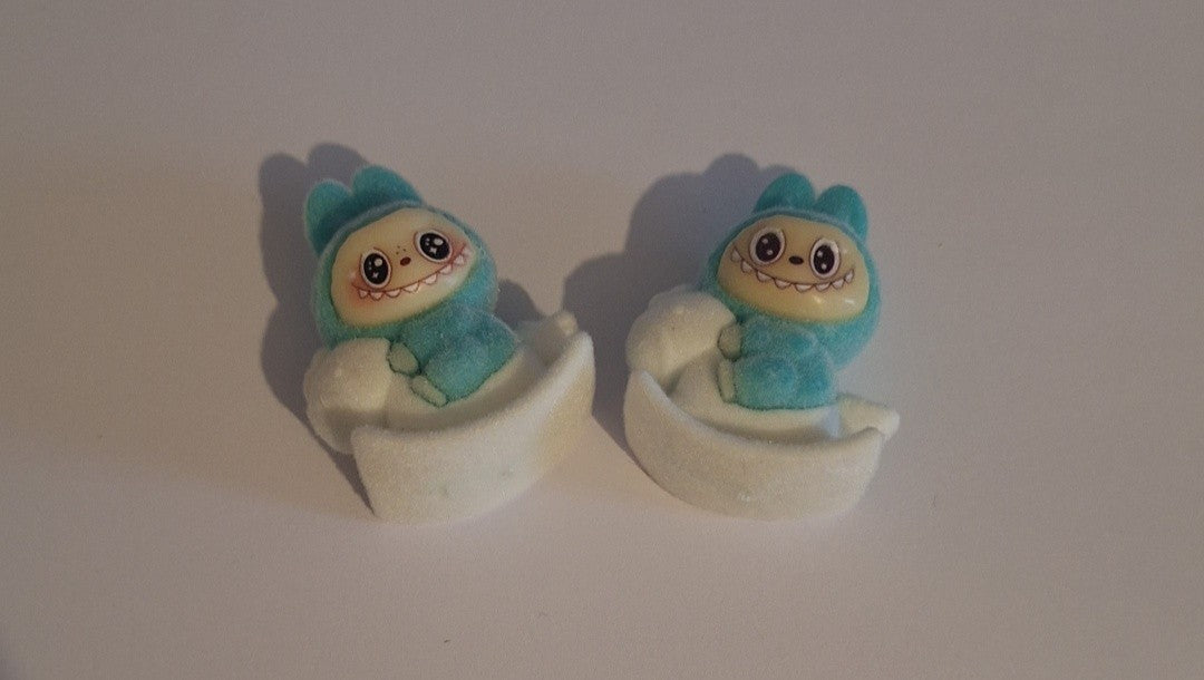 Blue labubu on white rocking horse felt feel beads