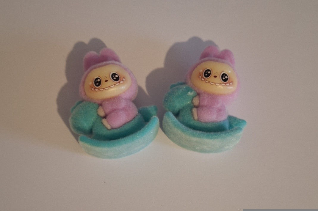 Purple labubu on blue rocking horse felt feel beads