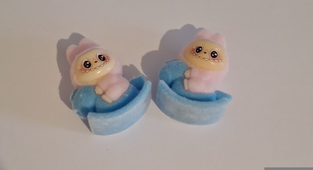 Light pink labubu on blue rocking horse felt feel beads