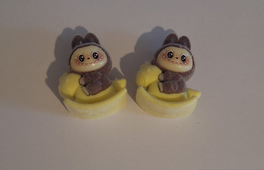 Brown labubu on yellow rocking horse felt feel beads